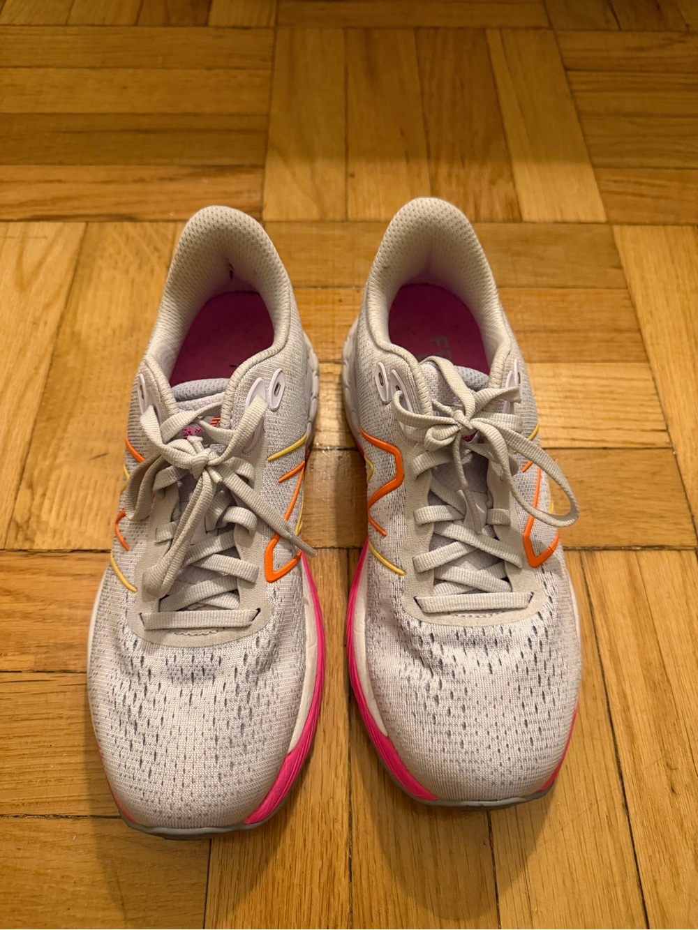 New Balance Light Purple Running Shoes with Pink and Orange Accents